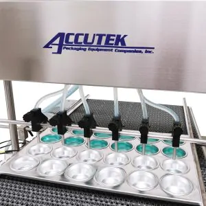 Bakery tray filling and depositing equipment